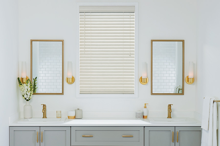 Beautiful and timeless white Polywood blinds are the perfect touch for your bathroom. White Polywood blinds in a modern styled bathroom
