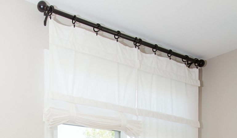 Tumble shades in San Antonio give your doors privacy versatility and style. White tumble shade on double glass doors